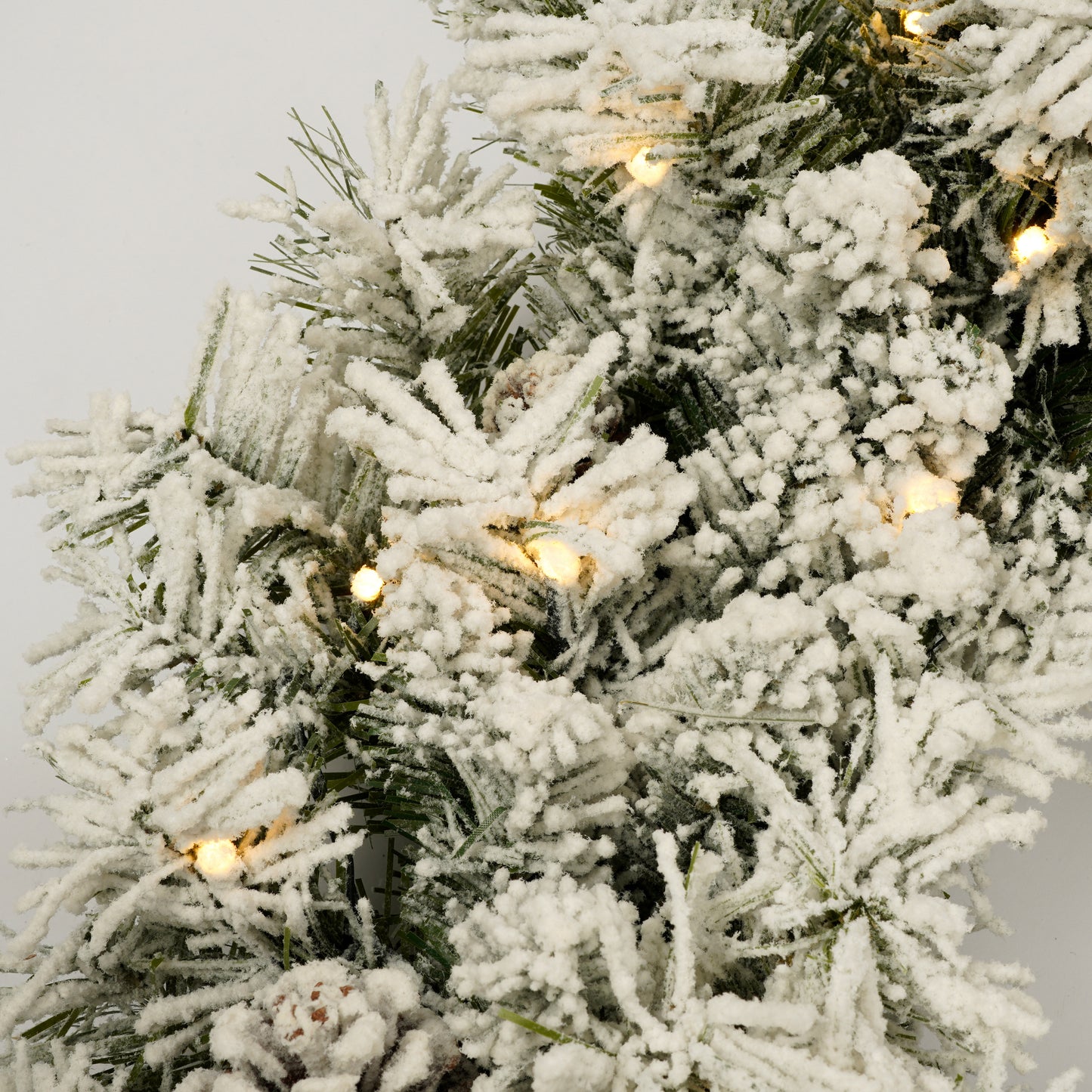 A set of 4 artificial Christmas trees